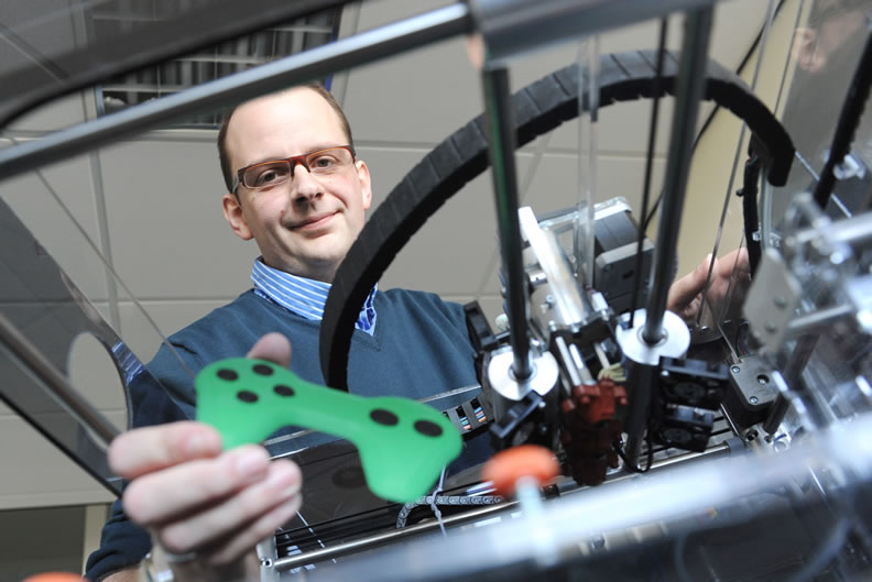 AM_game_10W7 Dr. Simon Leigh with 3D Printed Game Controller Photograph Courtesy of University of Warwick