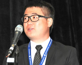 Kaiyi Jiang, 2014 Guy E. Bourdeau Scholarship recipient, addresses AMUG audience. (Photo courtesy of AMUG)
