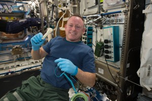 International Space Station Expedition 42 Commander Barry "Butch" Wilmore shows off a ratchet wrench made with a 3-D printer on the station. Image Credit: NASA