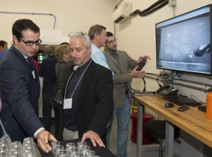 Mark J. Cola, Co-founder, President and CEO (right) at launch event (Photo courtesy of Sigma Labs Inc.)