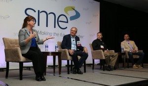 Dr. Elizabeth Jordan speaks at a panel discussion titled, “Enabling Growth of Thermoplastic Additive Manufacturing,” held at RAPID 2015 on May 18. Additional panelists, from left to right, include Jeff DeGrange, of Impossible Objects; Chad Duty, of Oak Ridge National Laboratory; and Matt Hlavin, of Thogus Products (Photo credit: Photography by Tony Kawashima, Inc.)