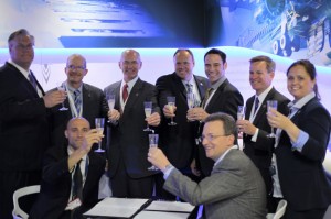 Mecachrome France CEO Arnaud de Ponnat and Norsk Titanium CEO Warren M. Boley, Jr. celebrate the signing of a Long Term Agreement for the supply of Rapid Plasma Deposition titanium parts to Mecachrome aerospace customers at the 2016 Farnborough International Airshow. (Photo: Business Wire)