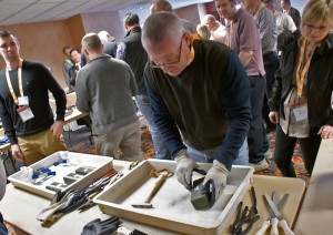 Hands-on workshop where participants use 3D-printed sand molds to cast metal parts. (Photo courtesy of AMUG)