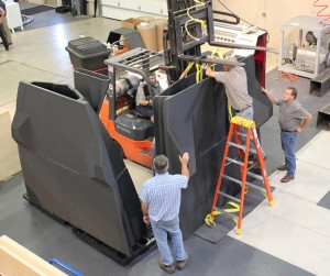 Bonding the boat hull pattern pieces together (Photo courtesy of Thermwood)