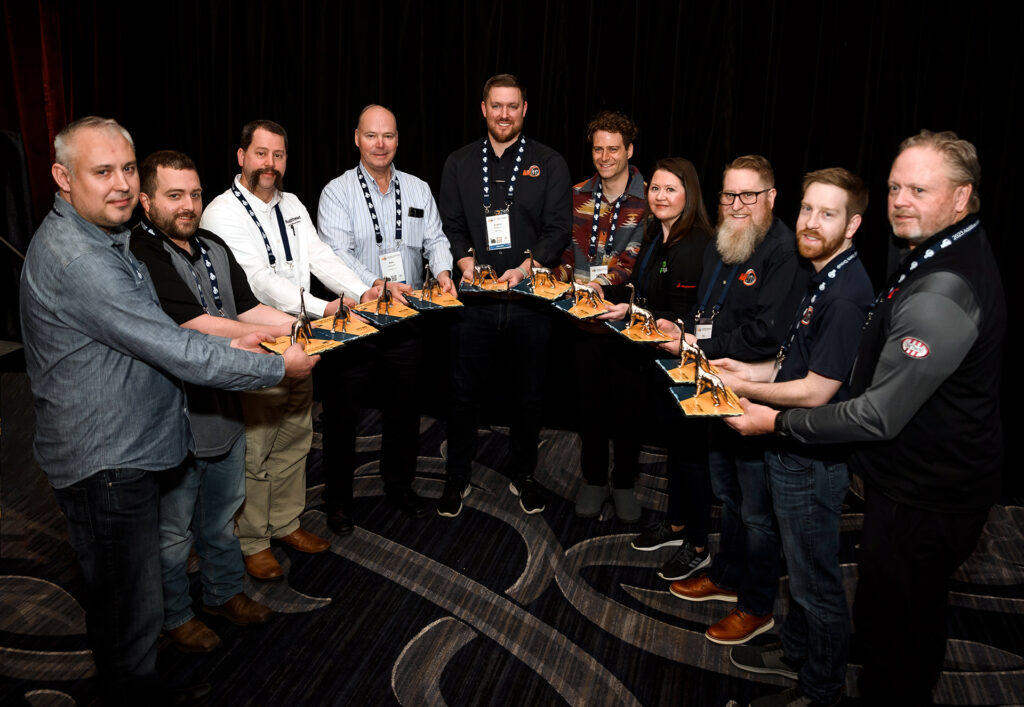 DINO Awards were presented to (from left) Bogdan Filipkowski, Matthew Mitchell, Dave Rittmeyer, Rob Hassold, Colton Rooney, Danny Levy, Heather Natal, Tim Bell, Alex Roschli, and Roger Nielsen.